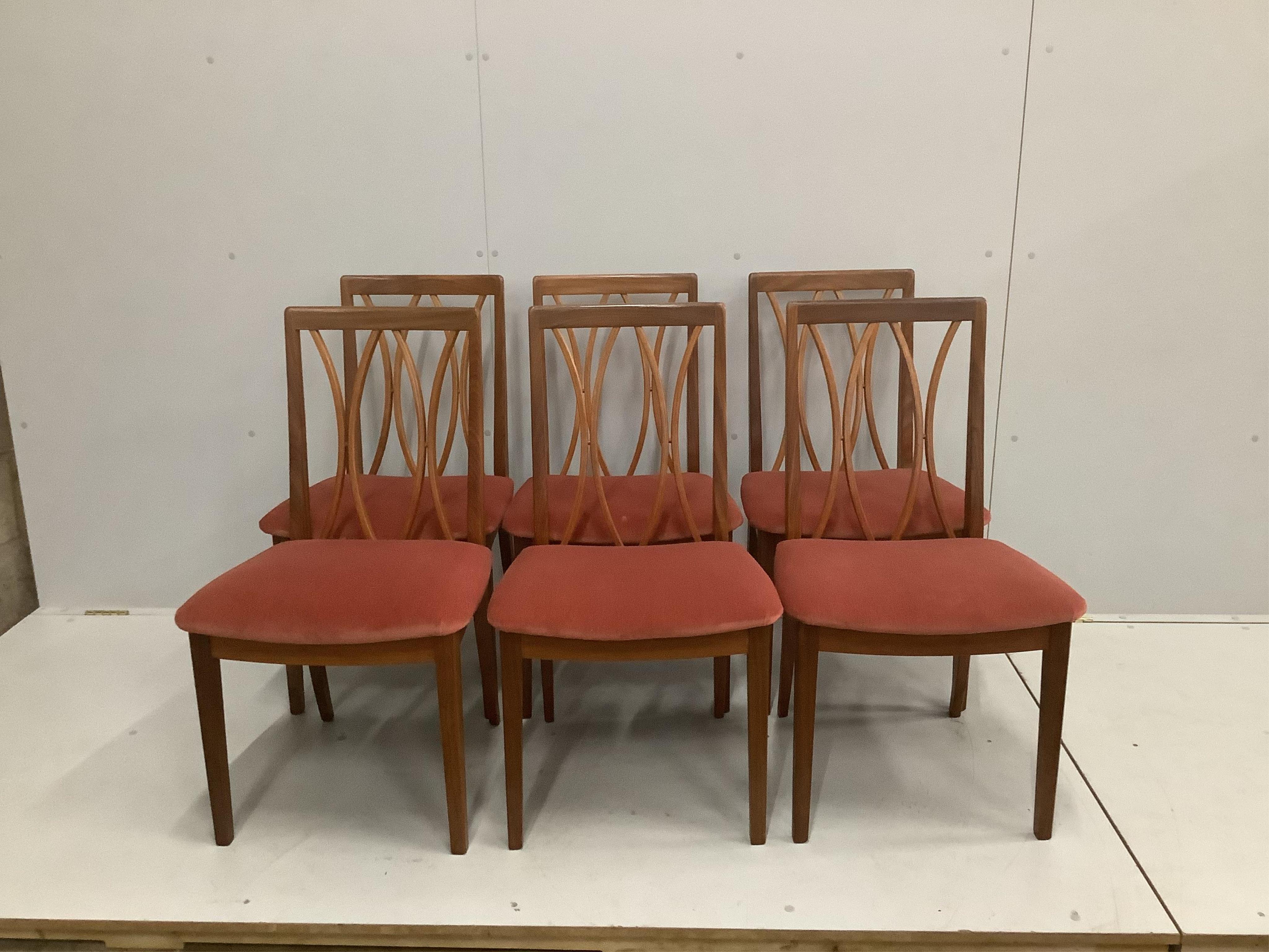 A mid century G Plan teak extending dining table, width 168cm extended, depth 122cm, height 73cm, together with six teak dining chairs. Condition - good